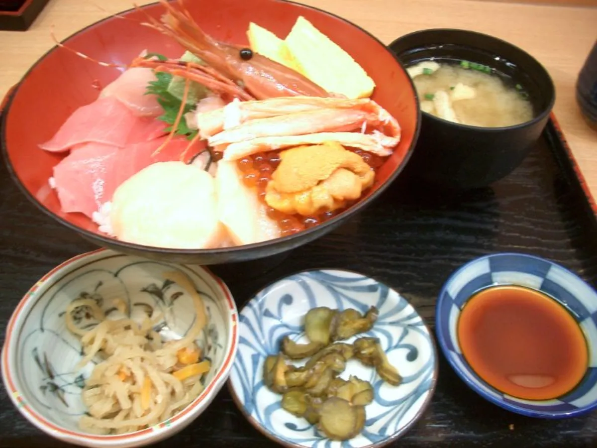 A generic seafood rice bowl (kaisendon style) with tuna, shrimp, crab and sea urchin, not from Tokyo Sushi Bowl