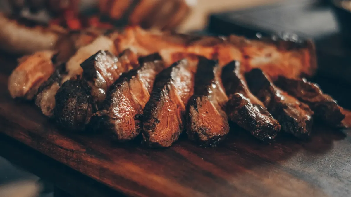 Halal wagyu beef being grilled on a tabletop yakiniku grill in Tokyo