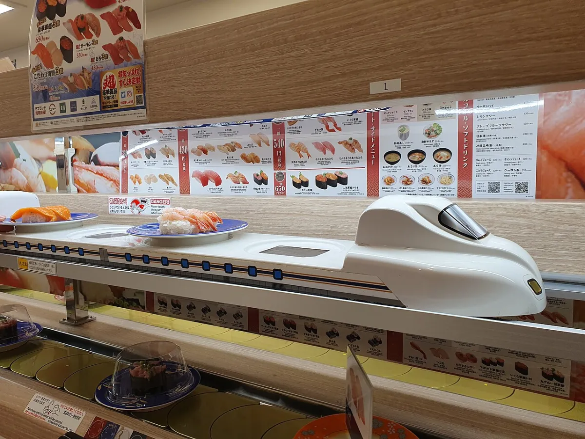 Shinkansen-shaped order delivery lane at a kaiten sushi restaurant in Japan