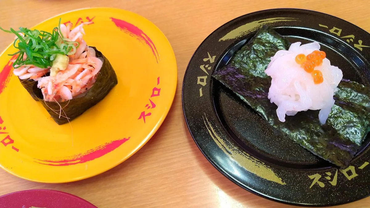 Plates in different colours and designs at a Sushiro kaiten sushi restaurant in Japan